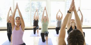 Yoga class being led by an instructor